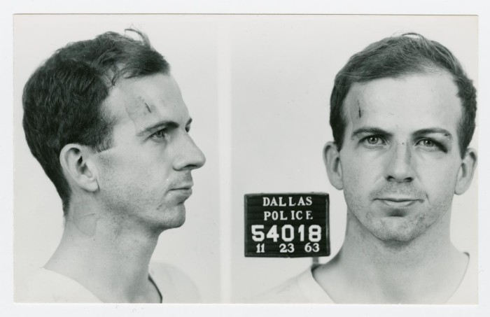 Dallas Police Department profile and frontal photographs of Lee Harvey Oswald, dated November 23, 1963